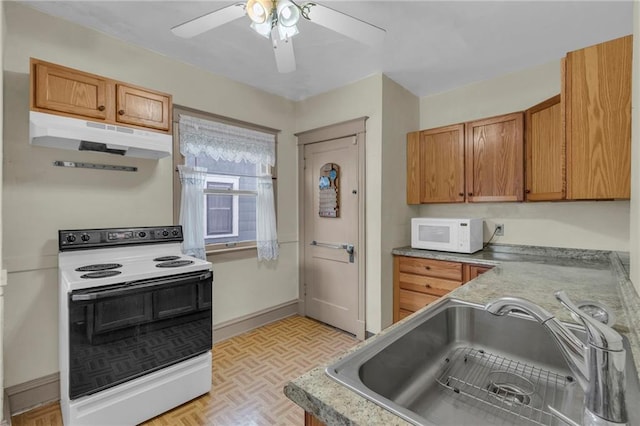 kitchen featuring ceiling fan, light parquet flooring, sink, and electric range oven