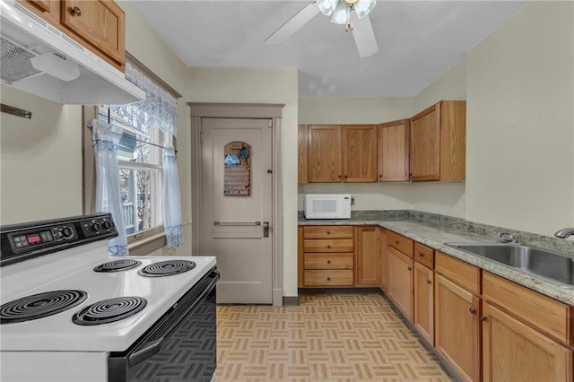 kitchen with sink, ceiling fan, light stone counters, range with electric stovetop, and light parquet flooring