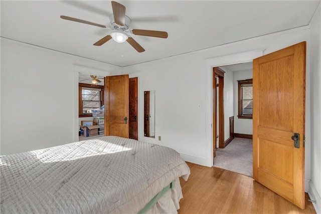 bedroom featuring ceiling fan and light wood-type flooring