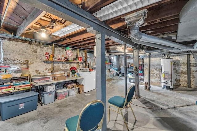 basement with washer and clothes dryer and gas water heater