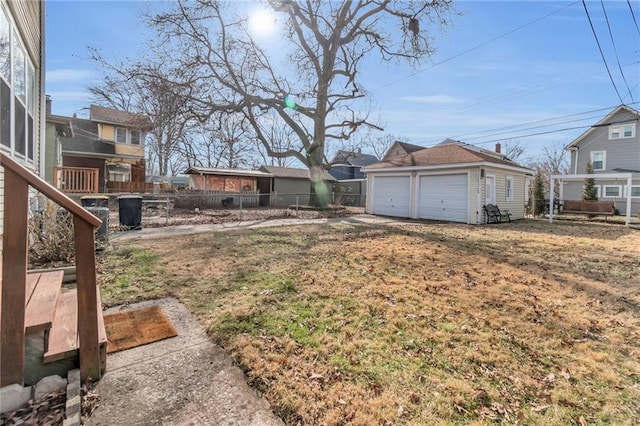 view of yard with an outbuilding and a garage