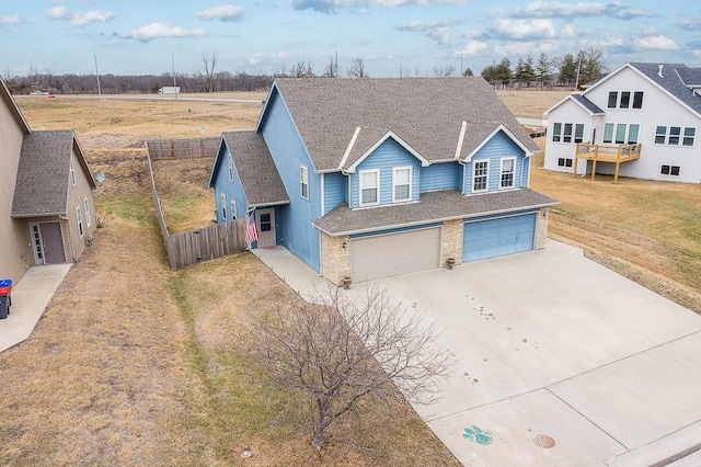 view of front of property featuring a garage and a front lawn