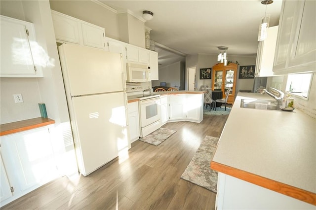 kitchen with white cabinetry, dark hardwood / wood-style flooring, kitchen peninsula, pendant lighting, and white appliances