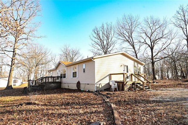 view of side of property with a wooden deck