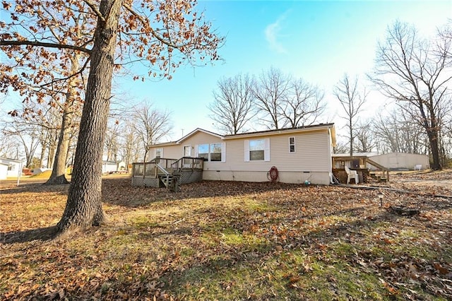 rear view of property with a deck