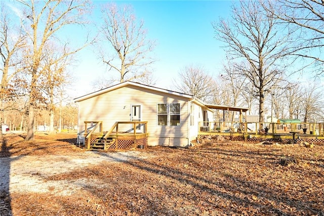 rear view of house with a deck