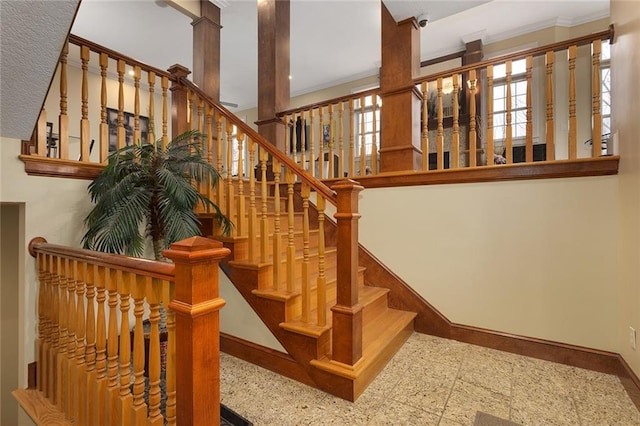 stairs featuring baseboards and a wealth of natural light