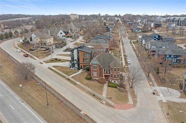 birds eye view of property with a residential view