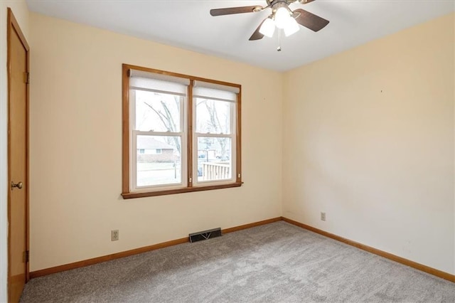 carpeted empty room with ceiling fan