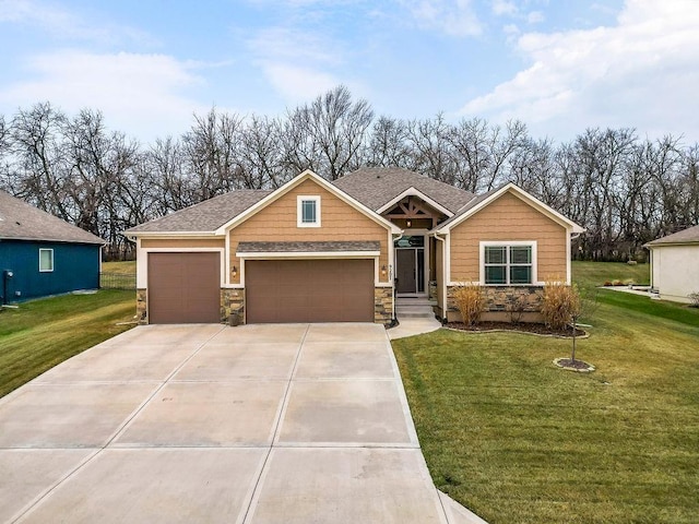 view of front facade with a garage and a front yard