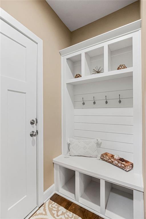 mudroom with dark hardwood / wood-style flooring