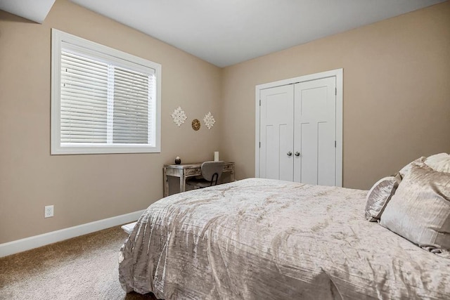 carpeted bedroom featuring a closet