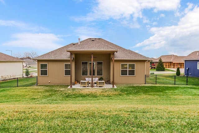 rear view of property featuring a yard, a patio area, and ceiling fan