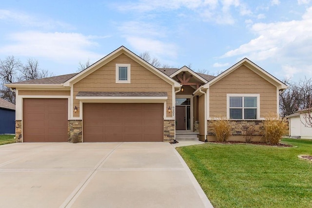 craftsman-style home with a garage and a front yard