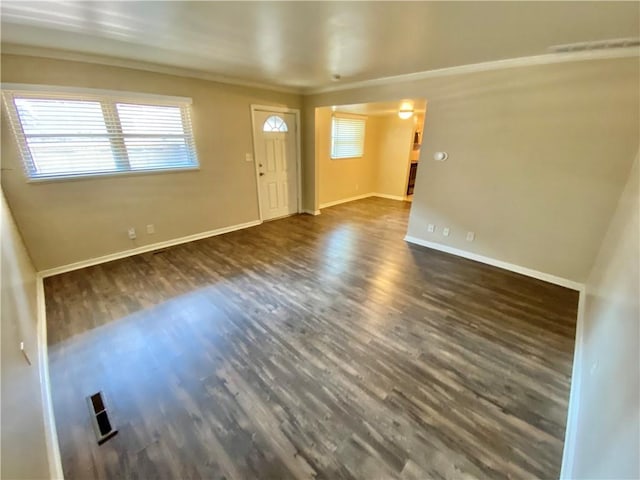 entrance foyer featuring crown molding and dark wood-type flooring