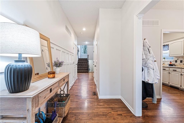 hallway featuring dark hardwood / wood-style flooring