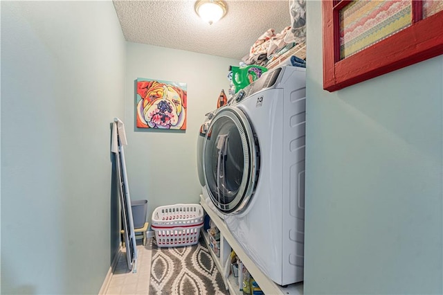 clothes washing area featuring a textured ceiling