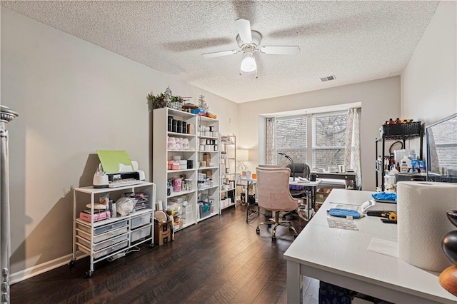 office space with ceiling fan, a textured ceiling, and dark hardwood / wood-style flooring