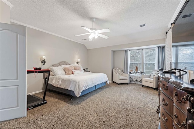 bedroom featuring carpet, a textured ceiling, lofted ceiling, and ceiling fan