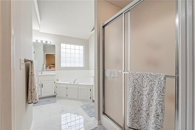 bathroom featuring vanity, plus walk in shower, and a textured ceiling