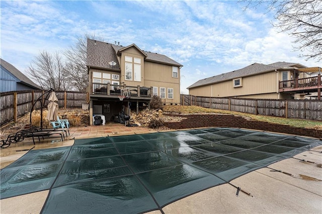 view of pool with a deck and a patio