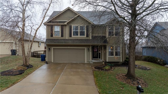 view of front facade featuring a garage and a front lawn