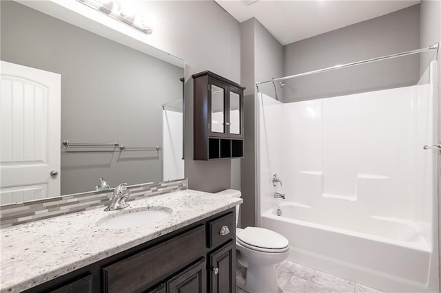 full bathroom featuring toilet, vanity, and shower / washtub combination