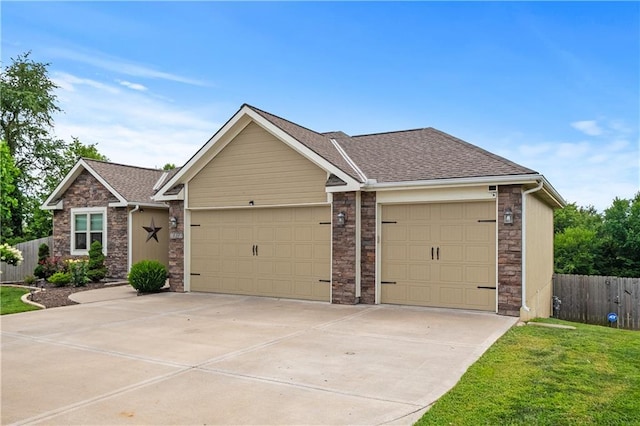 view of front facade with a garage and a front lawn