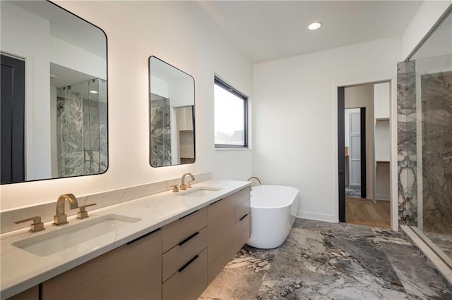 bathroom with vanity and separate shower and tub