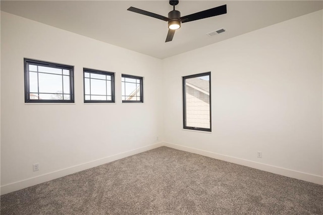 unfurnished room with ceiling fan and carpet flooring