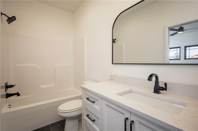 full bathroom featuring vanity, toilet, and tub / shower combination