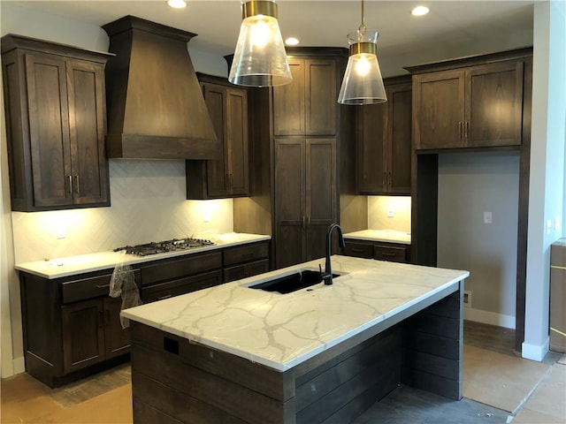 17178 S Heatherwood St, Olathe, KS 66062 - kitchen featuring premium range hood, a sink, baseboards, tasteful backsplash, and dark brown cabinets