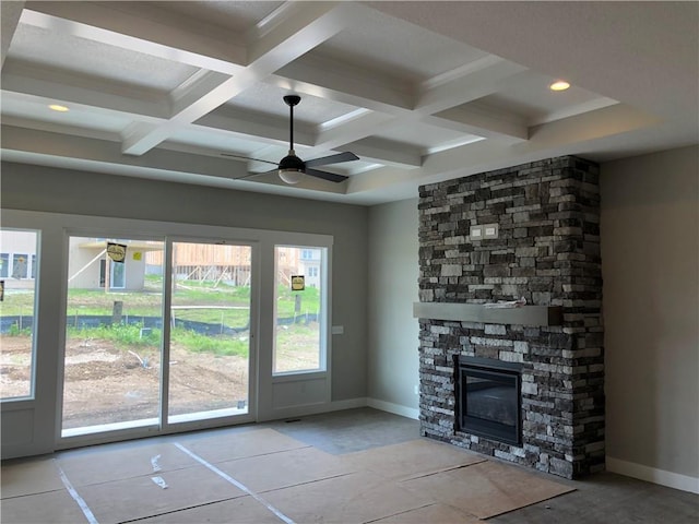 17178 S Heatherwood St, Olathe, KS 66062 - unfurnished living room featuring ceiling fan, coffered ceiling, baseboards, beamed ceiling, and a stone fireplace