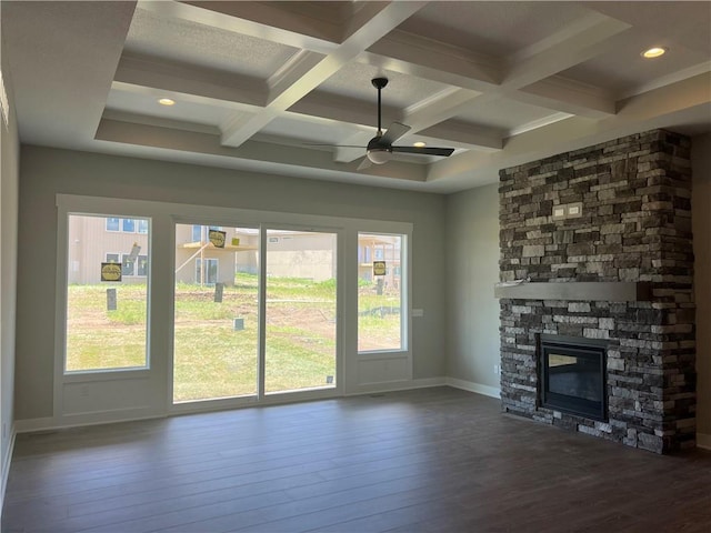 17178 S Heatherwood St, Olathe, KS 66062 - unfurnished living room with dark wood finished floors, beamed ceiling, ceiling fan, coffered ceiling, and a stone fireplace