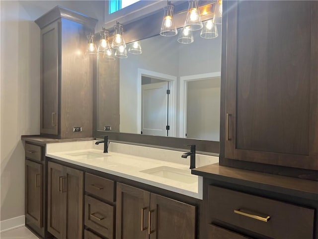 17178 S Heatherwood St, Olathe, KS 66062 - bathroom with double vanity and a chandelier