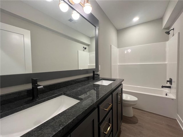 17178 S Heatherwood St, Olathe, KS 66062 - full bathroom featuring double vanity, washtub / shower combination, and wood finished floors