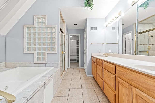 bathroom with vanity, plus walk in shower, and tile patterned flooring