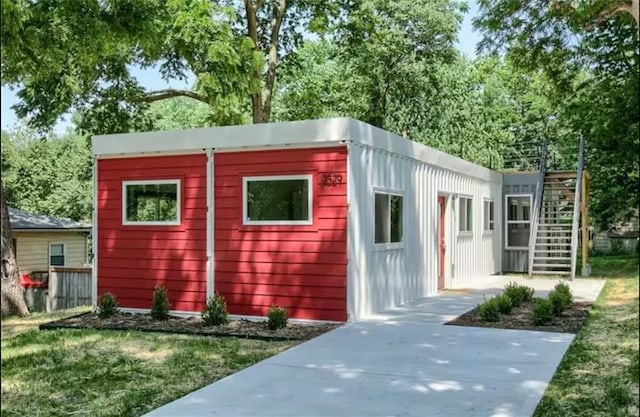 view of outbuilding with a lawn