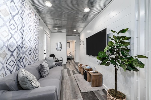 living room featuring hardwood / wood-style flooring and wood ceiling