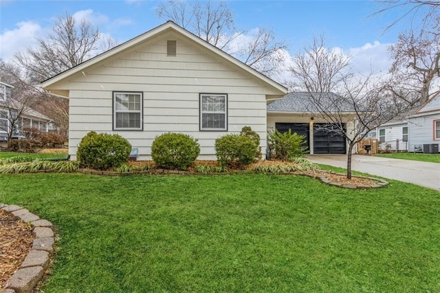 view of property exterior featuring a garage and a yard