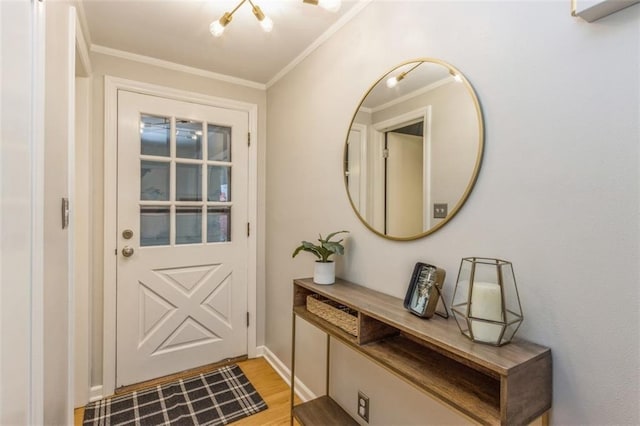 entryway featuring crown molding and light hardwood / wood-style flooring