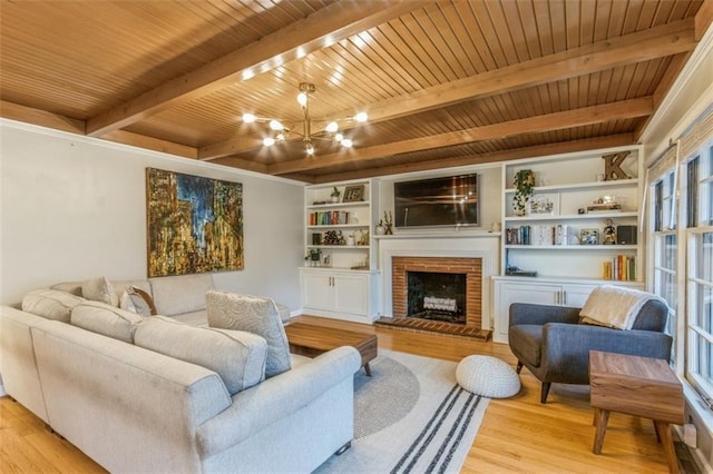 living room featuring a fireplace, a notable chandelier, wood ceiling, light hardwood / wood-style floors, and beam ceiling