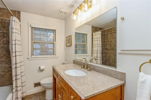 full bathroom with vanity, tile patterned floors, shower / bath combination with curtain, and toilet