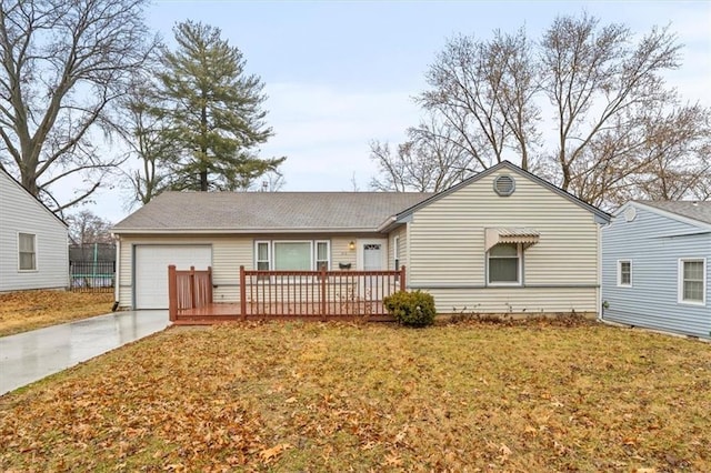 ranch-style home with a garage, concrete driveway, a front lawn, and a deck