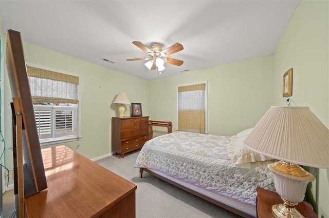 bedroom with a ceiling fan, carpet, visible vents, and baseboards