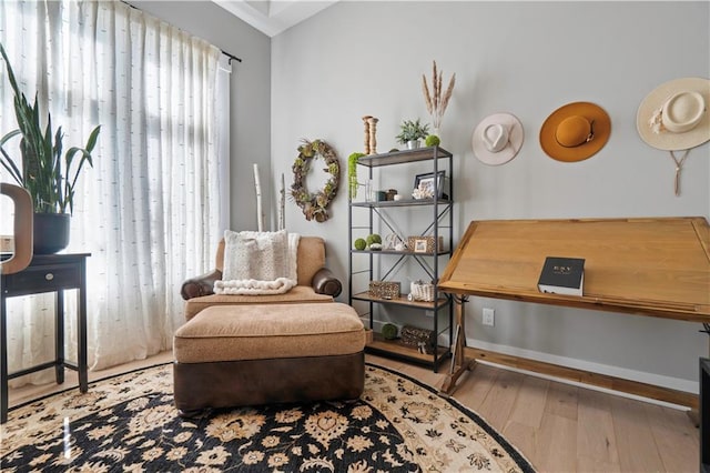 sitting room featuring light wood-style flooring and baseboards