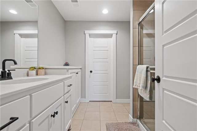 bathroom featuring a stall shower, visible vents, tile patterned floors, vanity, and recessed lighting