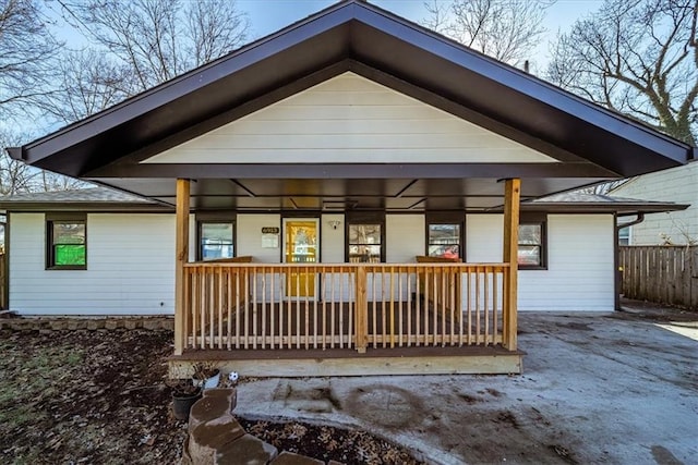 rear view of property with a porch