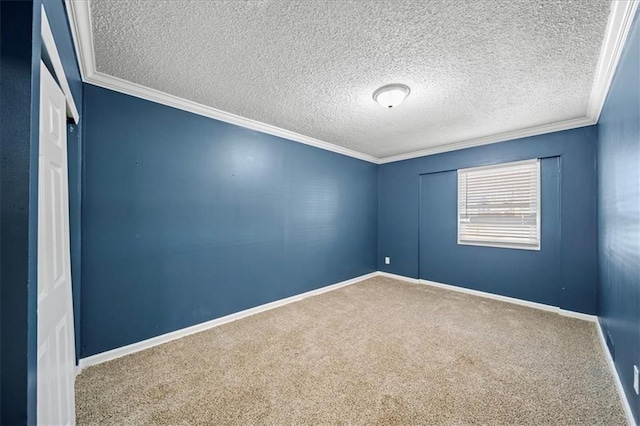 empty room featuring crown molding, carpet flooring, and a textured ceiling