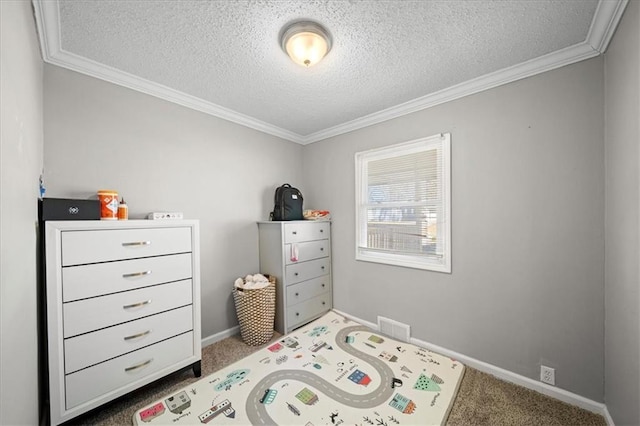 carpeted bedroom featuring ornamental molding and a textured ceiling